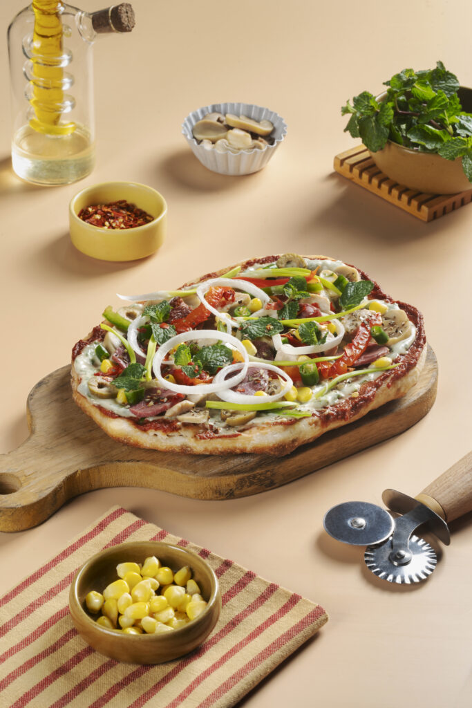 lamb flatbread pizza with herbs and cheese
